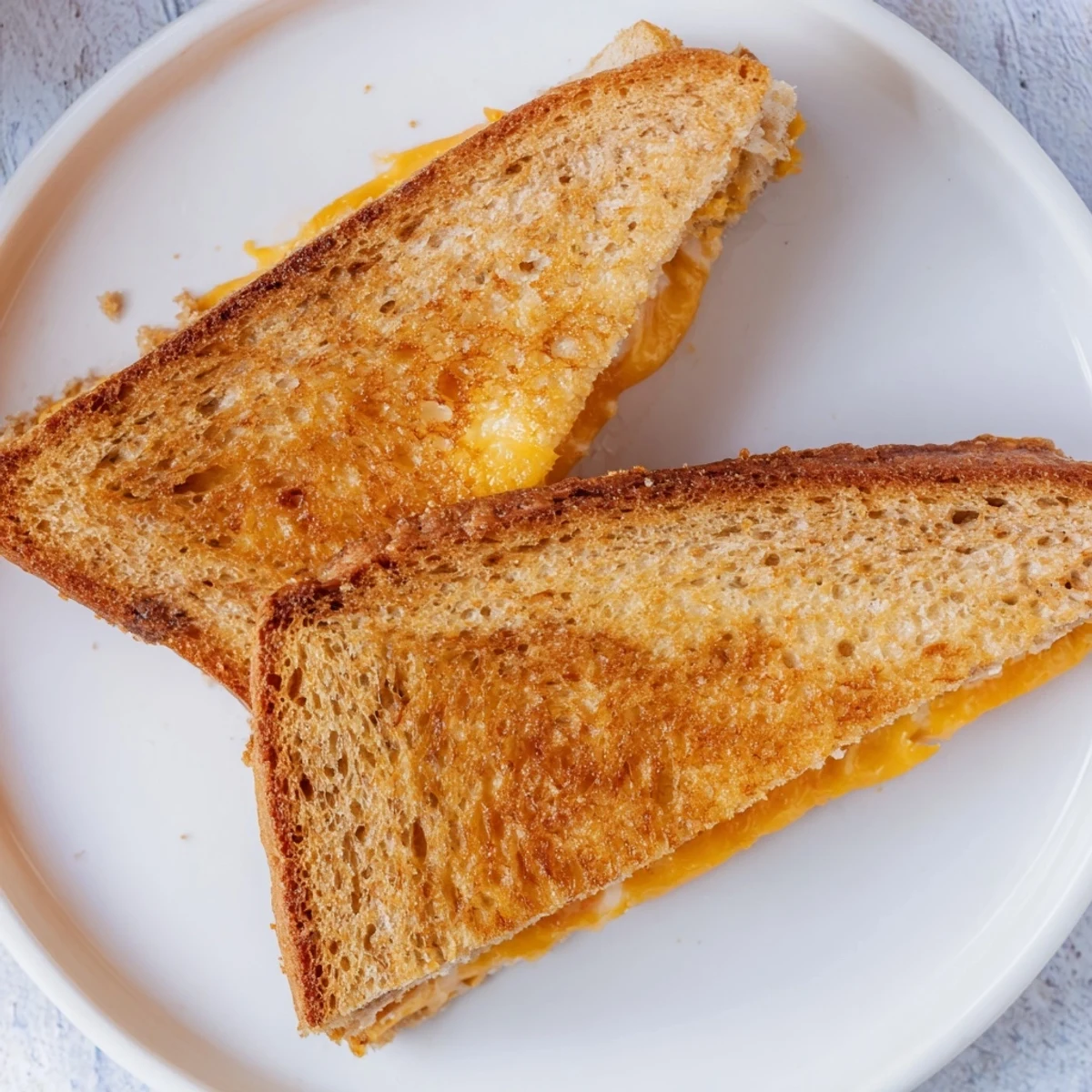 Crispy air fryer grilled cheese sandwich, oozing with cheese—perfect for a quick and easy lunch.