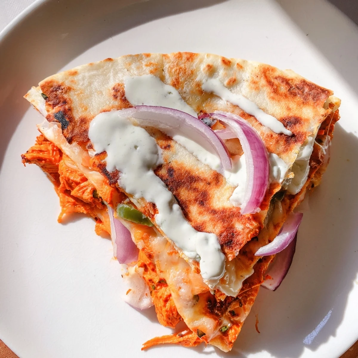 Golden-brown Tandoori Chicken Quesadilla, filled with melted cheese and savory spiced chicken.
