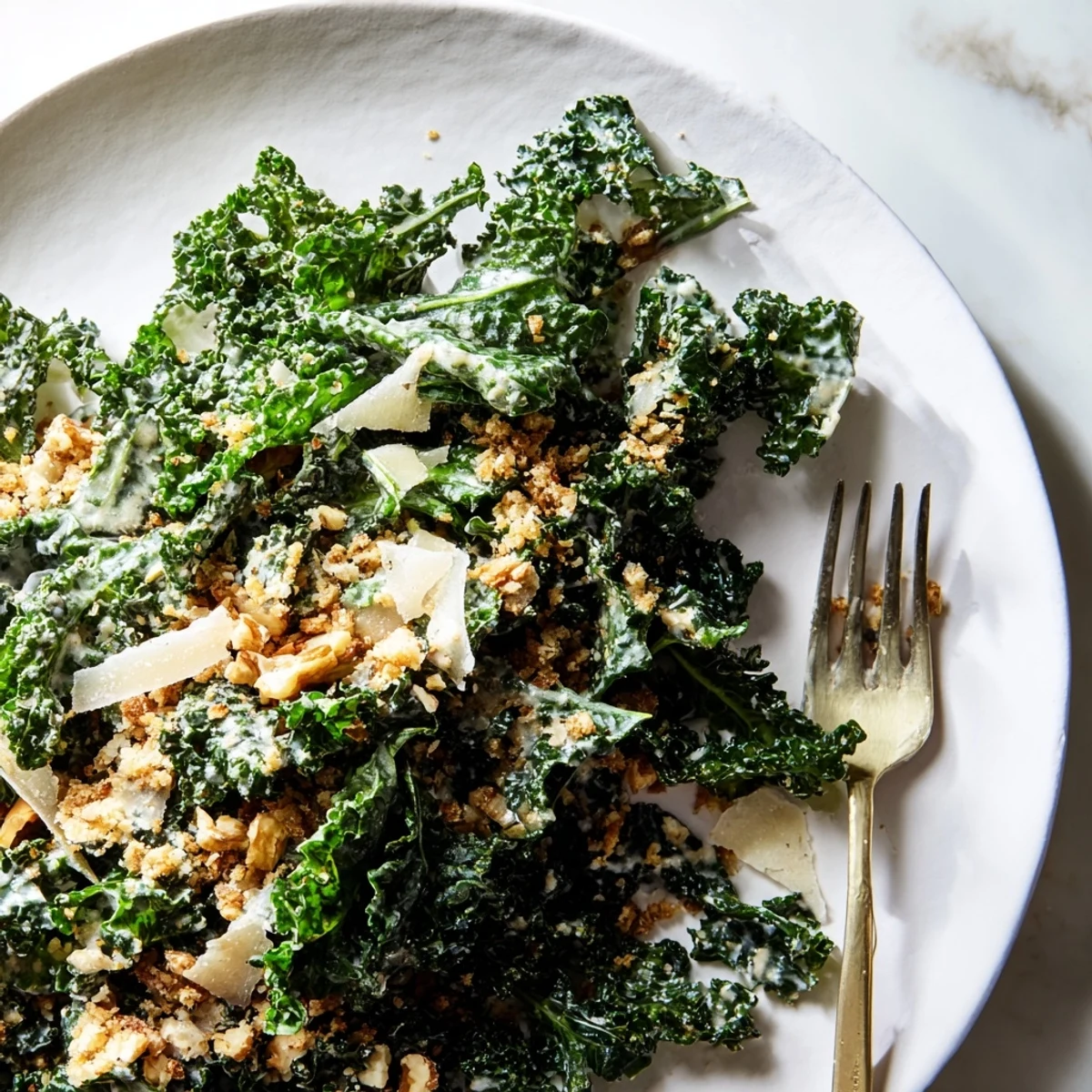 Serve this Garlic Parmesan Kale Salad as a light lunch or easy vegetarian side, with fresh lemon and crunchy panko breadcrumbs adding bright, savory notes.