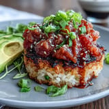 Savor spicy tuna crispy rice bites, a delightful appetizer experience.