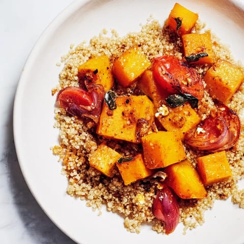 Vibrant Golden Honey-Roasted Butternut Squash Bowl, showcasing sweet squash nestled with quinoa and fresh ingredients.