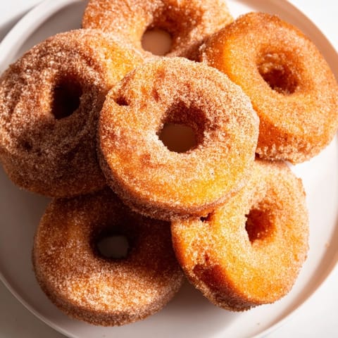 Close-up of freshly made 1-Minute Air Fryer Donuts: crispy outside, tender inside, perfect for dessert.