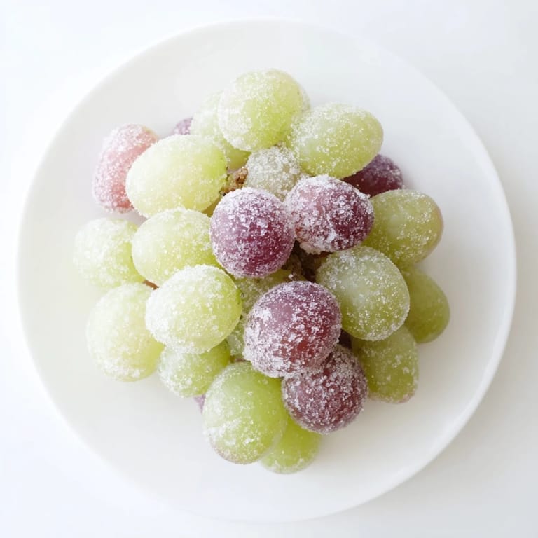 Vibrant red and green frozen grapes offering a perfect, cool, and healthy American snack.