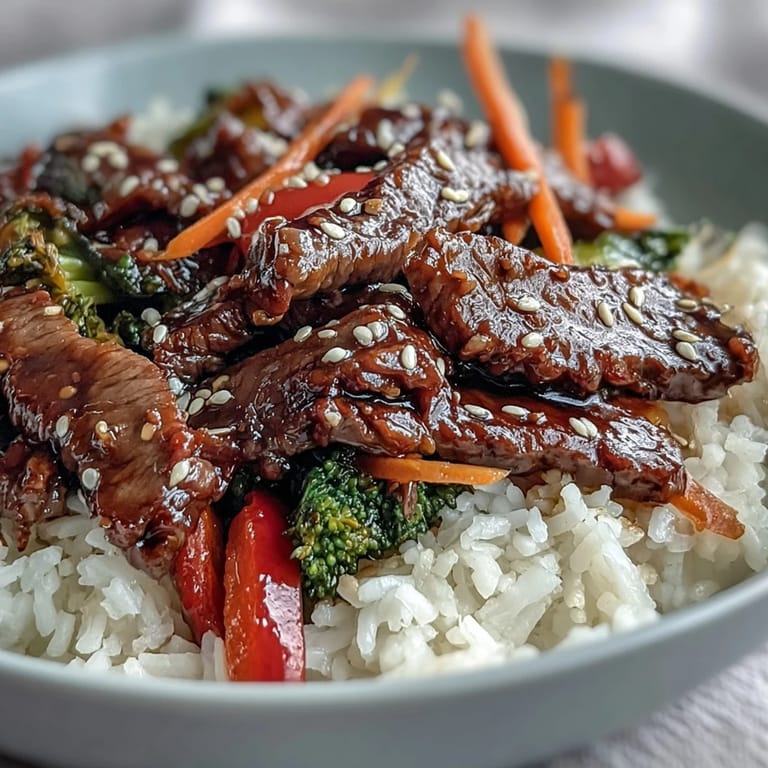A hearty bowl of homemade Japanese teriyaki beef with crunchy vegetables and steamed rice, ready to serve.