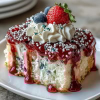 Memorial Day Red White Blue Poke Cake: vibrant berry swirls meet fluffy whipped topping.